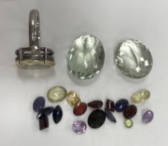 A bag of loose cut gemstones to include sapphires, garnet, citrine and topaz (7 pairs,