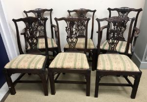 A set of six unusual mahogany dining chairs in the Chippendale taste,