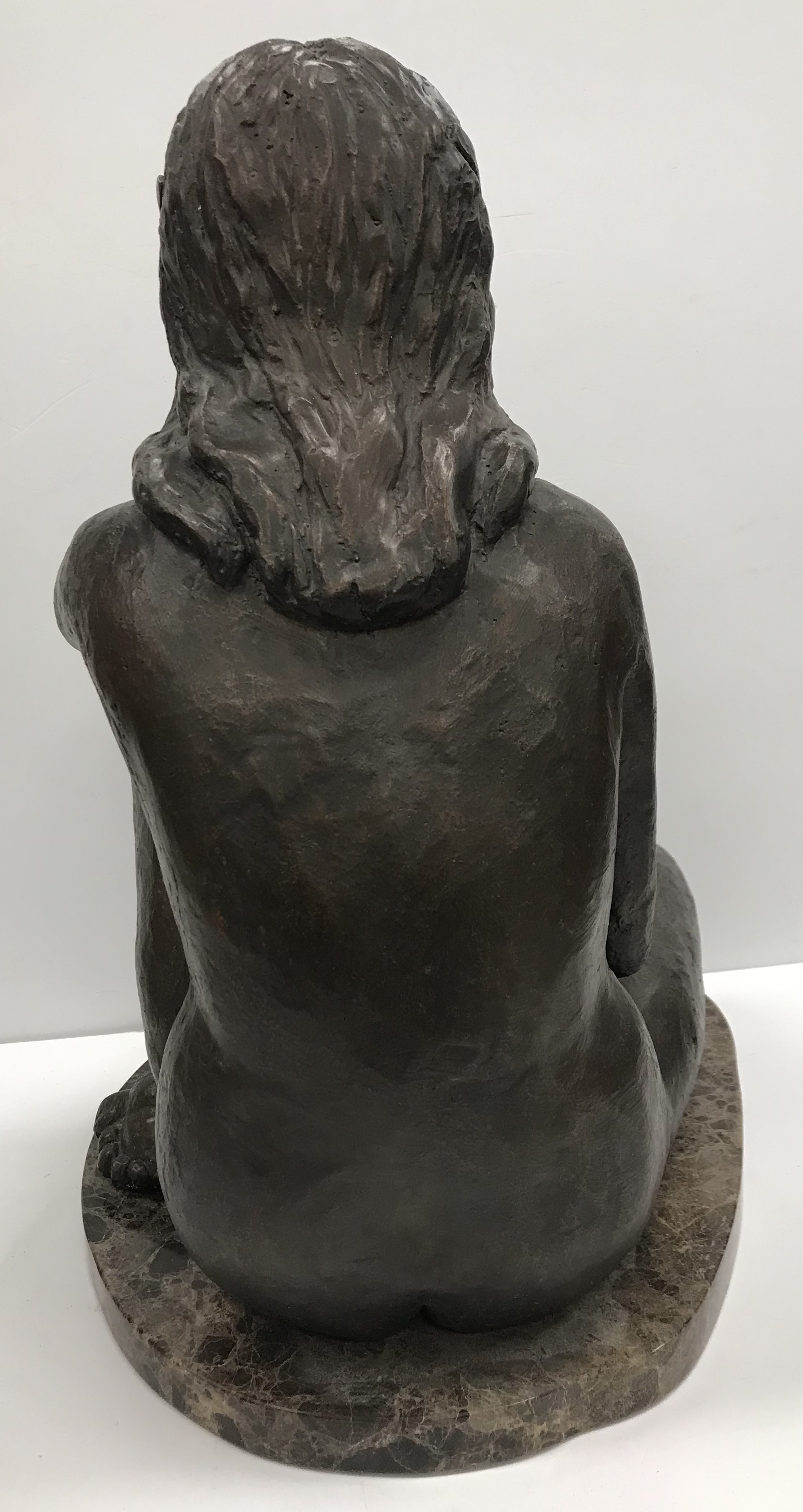 A mid 20th Century chocolate patinated bronzed figure of "Young nude girl seated" on a marble base, - Image 2 of 2