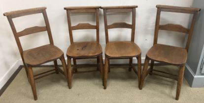 A set of four circa 1900 beech and elm chapel style chairs with panel seats,