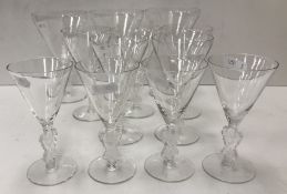 A part suite of twelve Lalique “Strasbourg” conical glasses with figural decorated stems,