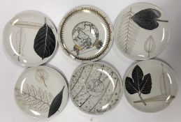 A collection of six Fornasetti of Milan plates including "No. 9 Astronomica" and "No.
