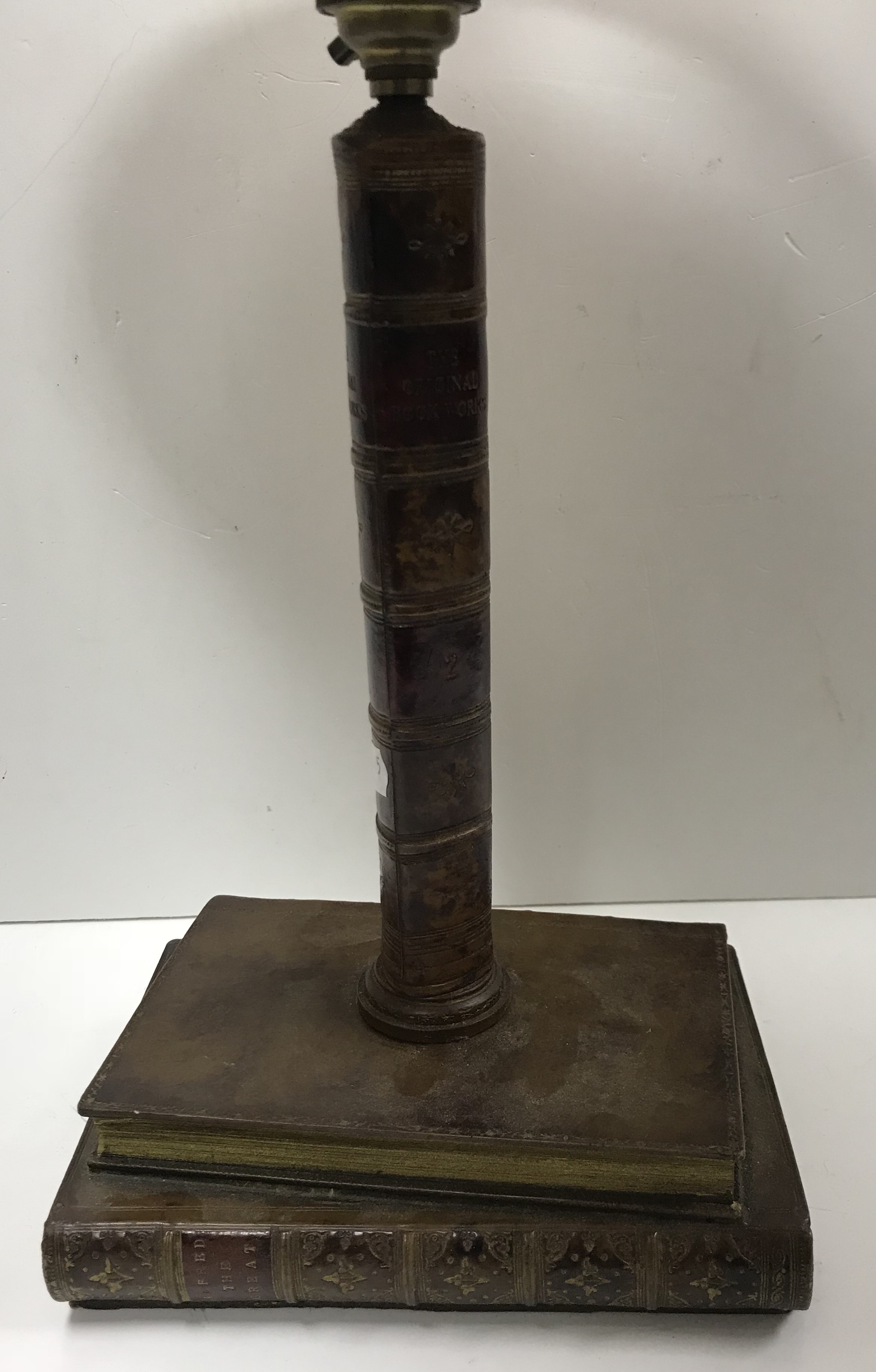 A decorative table lamp as book spines "Original Bookworks - 2" on a base of two books "Goldsmiths - Image 2 of 5