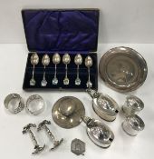 A selection of silver wares comprising a cased set of six silver commemorative spoons,