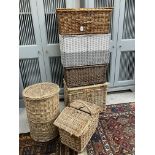 A collection of various wicker picnic and laundry hampers/baskets,