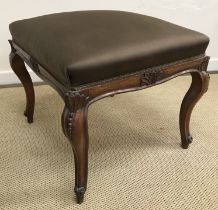 A Victorian walnut framed and carved drawing room stool,
