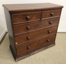 A Victorian mahogany chest of two short over three long graduated drawers with turned knob handles,