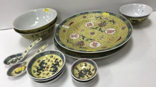 A collection of famille jaune/rose porcelain wares to include a pair of rice bowls with plain