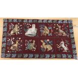 A needlepoint panel set with animal motifs in a tiled design to include leopard, monkey, greyhound,