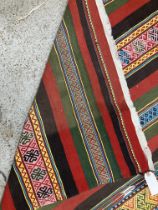 A Kelim rug of multi-coloured stripe design approx.