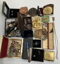 A box containing a collection of costume jewellery to include various paste set brooches,