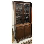 A mahogany bookcase cabinet in the Georgian style,