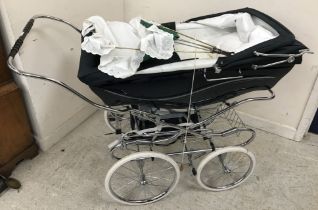 A Silver Cross pram of typical form on sprung base