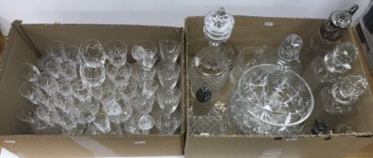 Two boxes of various cut glass ware including a Waterford pineapple and facet cut glass decanter