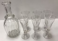 A set of six facet cut glass trumpet-shaped flutes on knop stems in the mid 18th Century style,