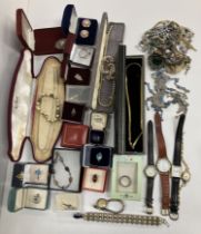 A box of various costume jewellery including rings, necklaces, brooches, etc.