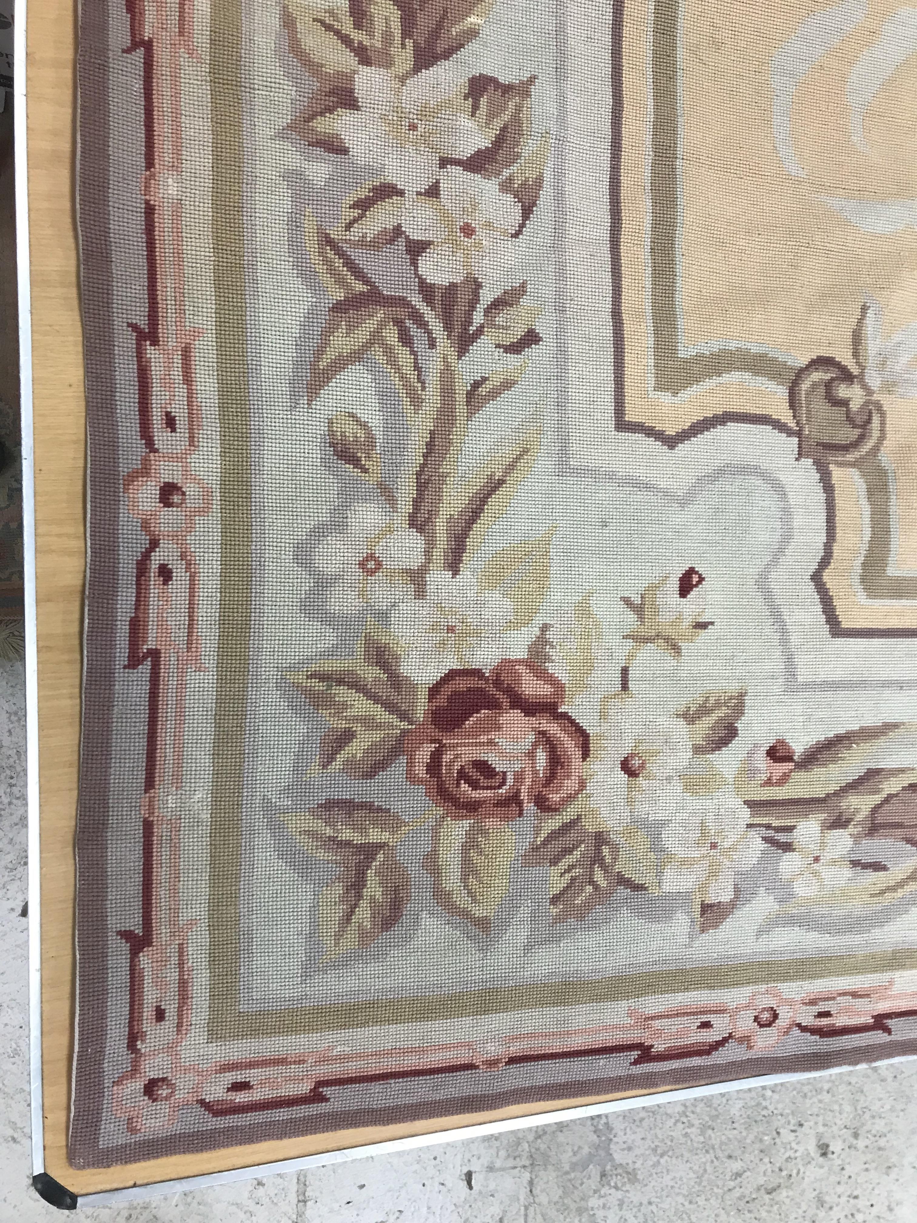 A needlepoint rug, the peach ground set with scrolling foliate design within a stepped border, - Image 2 of 9