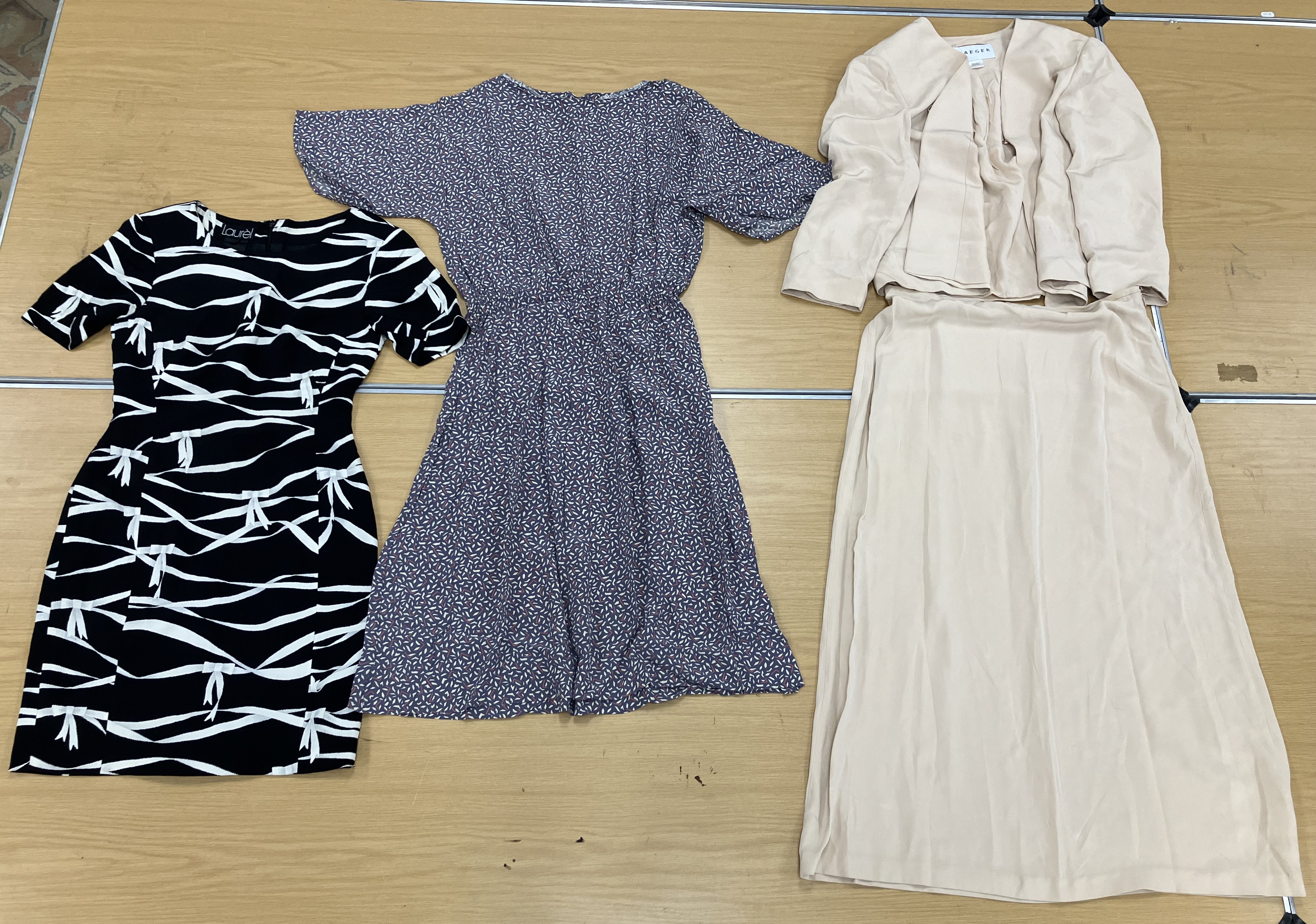 A box containing six various dresses comprising a fitted black and white patterned dress by Laurel