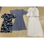 A box containing six various dresses comprising a fitted black and white patterned dress by Laurel