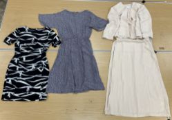 A box containing six various dresses comprising a fitted black and white patterned dress by Laurel