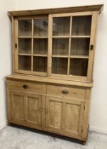 An early 20th Century pine kitchen cabinet,