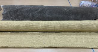 A remnant roll of furnishing velvet in mushroom together with a remnant roll of furnishing tweed