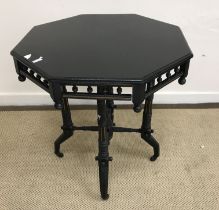 An ebonised and gilt-lined octagonal occasional table in the Aesthetic taste,