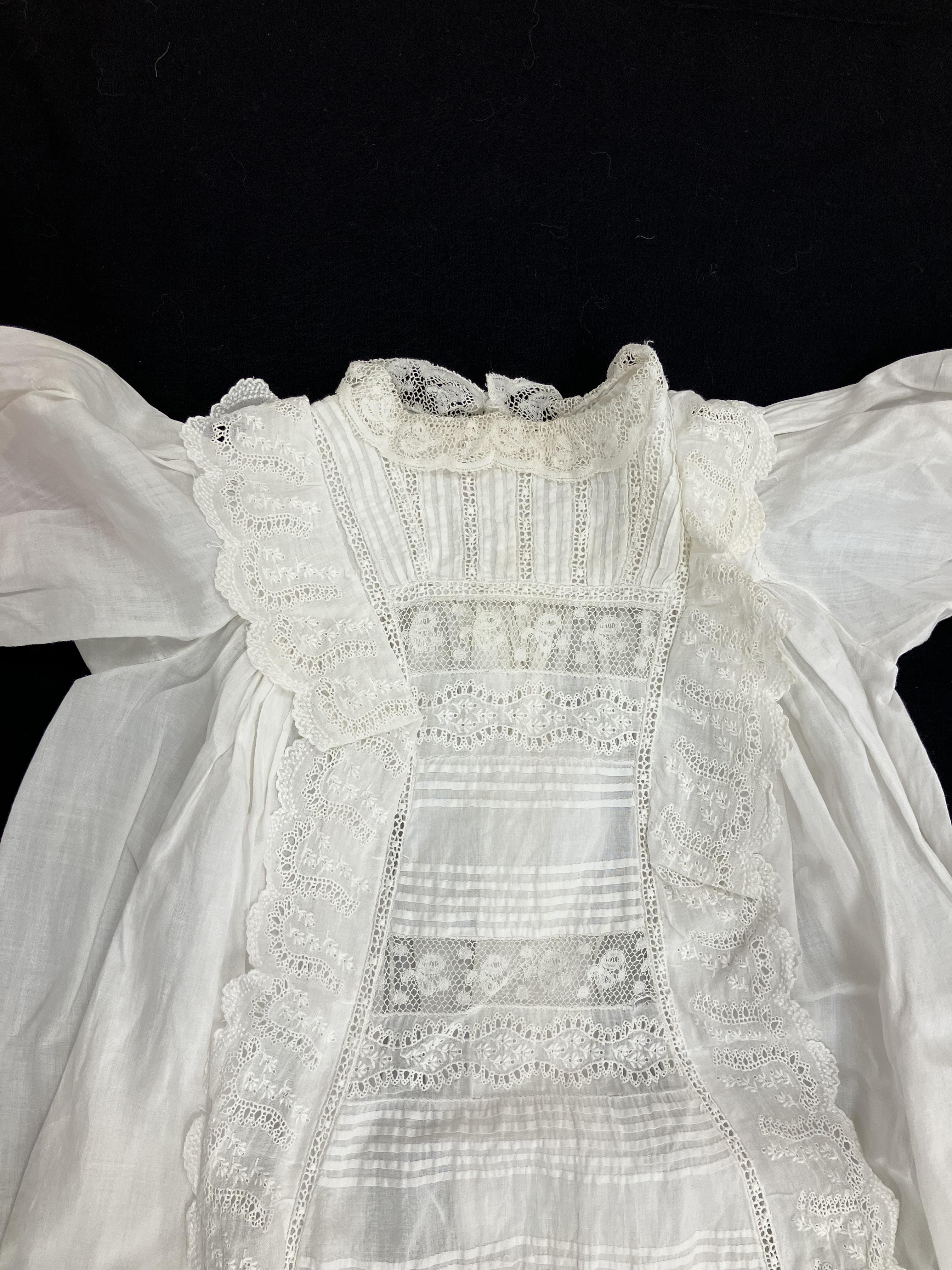 A circa 1900 Honiton type lace Christening gown with floral and foliate decoration and fine work to - Image 3 of 7