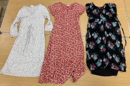 Six various modern dresses comprising a grey and white dress with long sleeves by Adini,