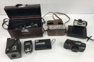 A collection of various photographic equipment to include a Leica C2-Zoom camera with soft case and