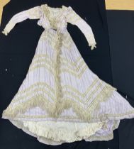 A circa 1900 silk and lacework day dress in white and purple design, with satin stitched stripes,