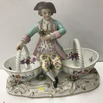 A late 19th Century Dresden figural salt as a gentleman in 18th Century dress and tricorn hat with