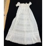 A circa 1900 Honiton type lace Christening gown with floral and foliate decoration and fine work to