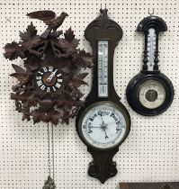 A 20th Century carved treen ware cased cuckoo clock of typical form,