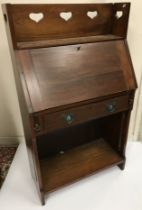 An Edwardian mahogany Arts & Crafts style student's bureau,