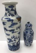 A Chinese blue and white vase, the main body decorated with five toed dragons amongst clouds,