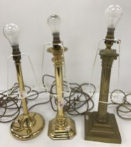 A collection of three brass table lamps, one with stepped square base and column design, 44.