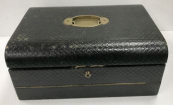 A late Victorian leather covered travelling writing slope/attache box with brass carry handle,