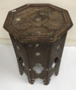A 19th Century Syrian carved hardwood and mother of pearl inlaid octagonal occasional table with
