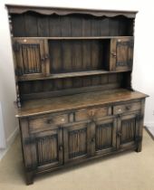 A modern oak dresser in the 17th Century style,