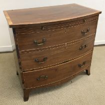 A 19th Century mahogany bow fronted bachelor's chest, the plain top satinwood cross-banded,