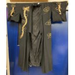 A mid 20th Century silk kimono with couched embroidered dragon and cloud decoration