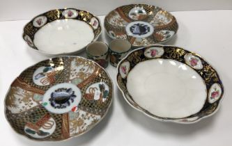 A pair of Chinese Imari palette decorated plates with panelled and fruit decoration each bearing