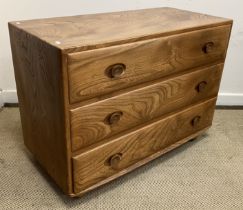 A 1960s Ercol elm chest of three drawers,