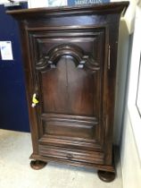 An 18th Century French walnut armoire or cupboard in the Provincial Louis XV taste,