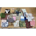 Three boxes of assorted vintage fabric,