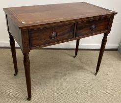 A mahogany and cross banded two drawer side table in the Regency taste raised on turned legs to