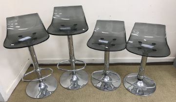 A set of four Italian smoked acrylic and chrome rise and fall bar stools, 71.5 cm high min / 98.