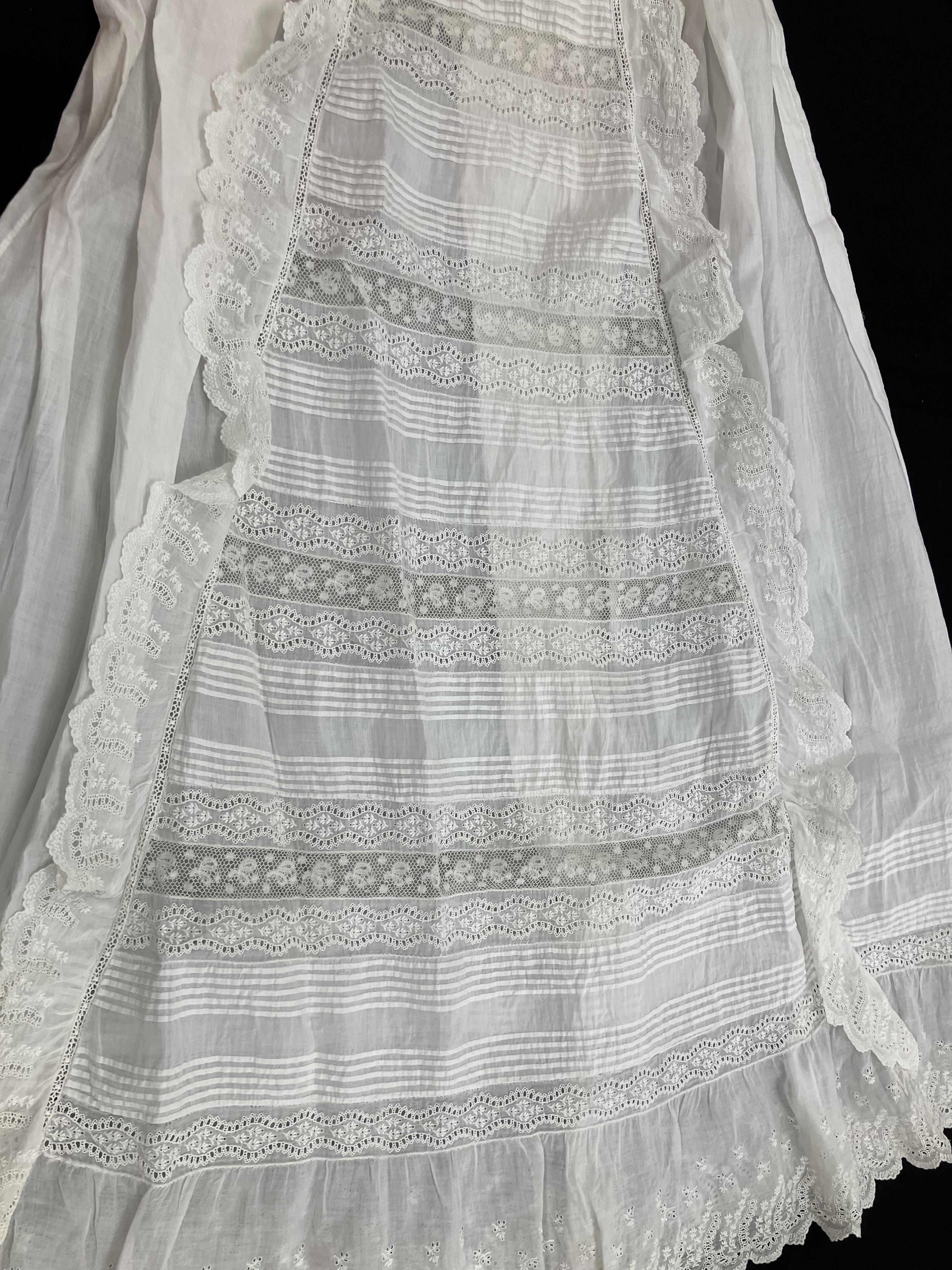 A circa 1900 Honiton type lace Christening gown with floral and foliate decoration and fine work to - Image 5 of 7