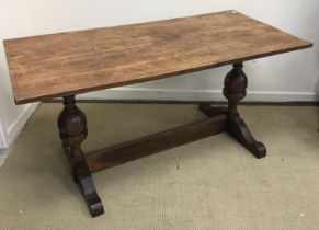 A 20th Century oak refectory style dining table in the 17th Century manner,